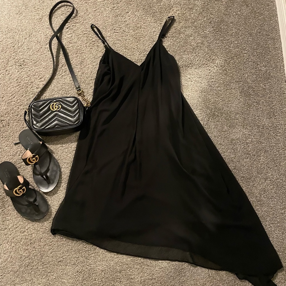 WHBM black dress with sheer fabric. Size 4 excellent condition.